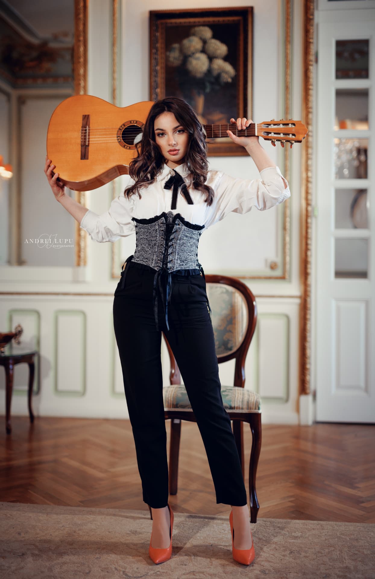 Portrait of Alexandra Păceană holding her classical guitar